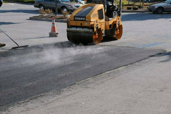 asphalt repair process compaction image